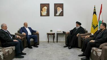 Hezbollah chief Hassan Nasrallah, second from right, meets a Hamas delegation led by Khalil Al Hayya, second from left, at an undisclosed location in Lebanon.  AFP