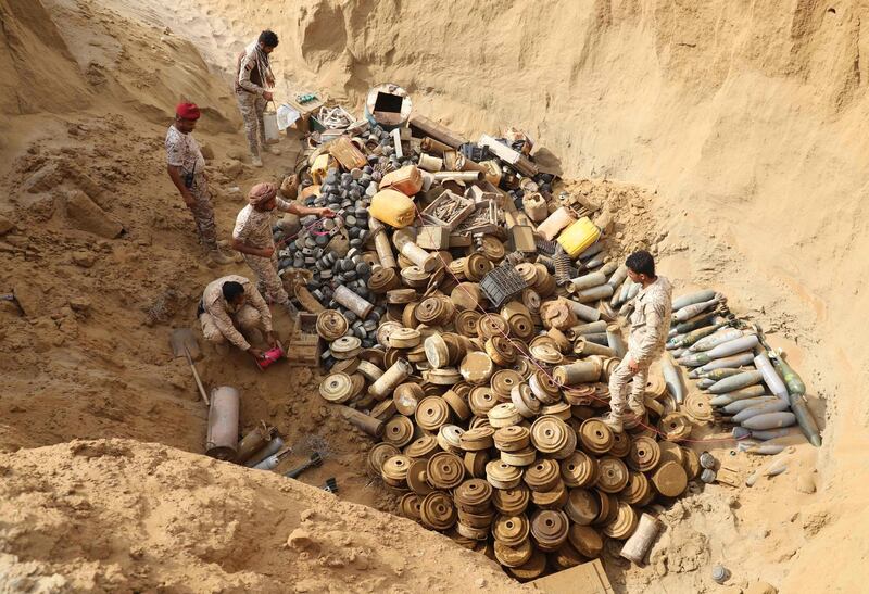 A joint Saudi-backed Sudanese-Yemeni force removes landmines, which they said were planted by the Iran-aligned Houthi rebels in Yemen's northern coastal town of Midi, in the Hajjah governorate.  AFP