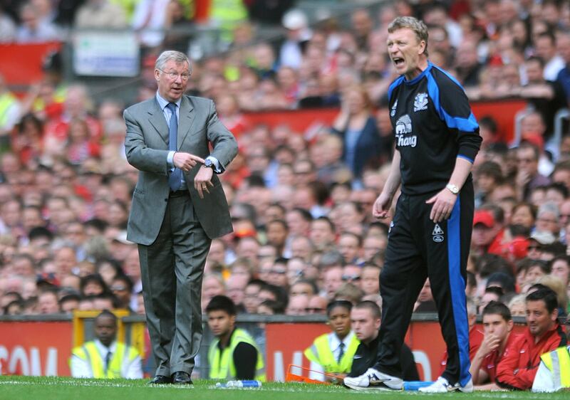 Everton manager David Moyes (right) shouts instructions to his team as Manchester United manager Alex Ferguson gestures to the officials regarding the amount of added time, on the touchline