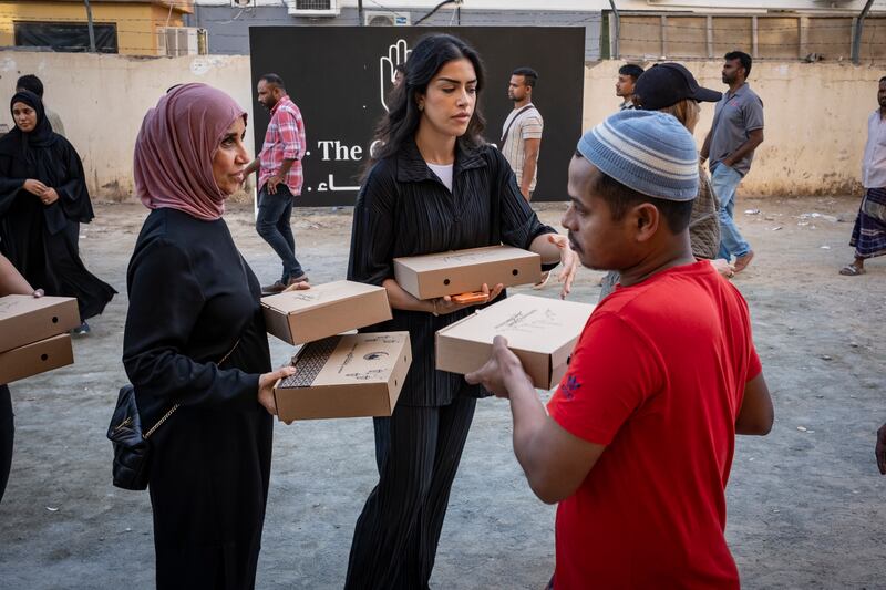 The Giving Family hands out iftar meals in Al Quoz Industrial 1. Antonie Robertson / The National