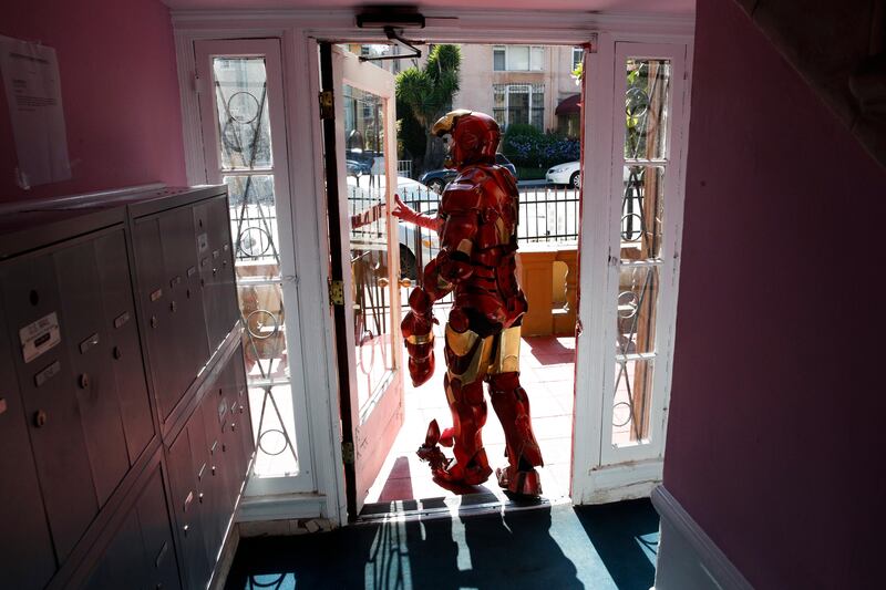 Wearing a $5,000 Iron Man costume, actor Paul Louis Harrell leaves his apartment building, in the Hollywood section of Los Angeles. "I'm successful because I have the best costume on the block and it's the most expensive one on the block," said Harrell. Longtime street performers like Harrell have concerns. They say business used to be more lucrative until the boulevard became overpopulated with costumed characters. What's worse, some look grungy, while others turn off tourists with aggressive demands for money. Jae C Hong / AP Photo