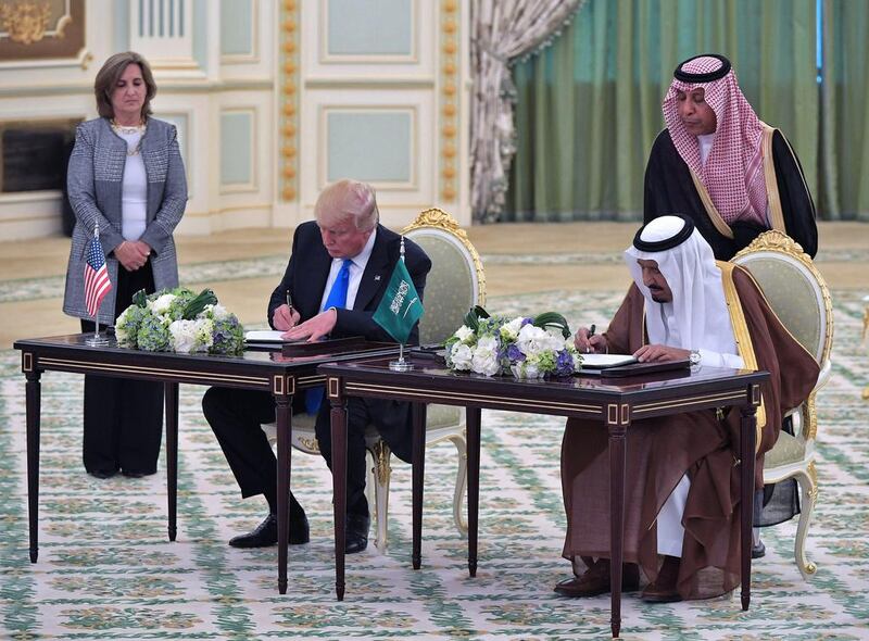 Mr Trump and King Salman take part in a signing ceremony at the Saudi Royal Court in Riyadh on May 20, 2017. / AFP / Mandel Ngan