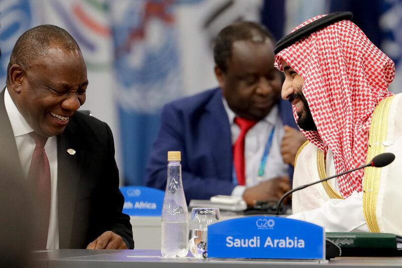 South Africa's President Cyril Ramaphosa, left, and Saudi Arabia's Crown Prince Mohammed bin Salman, smile at the start of the G20 summit in Buenos Aires, Argentina, Friday, Nov. 30, 2018. (AP Photo/Natacha Pisarenko)