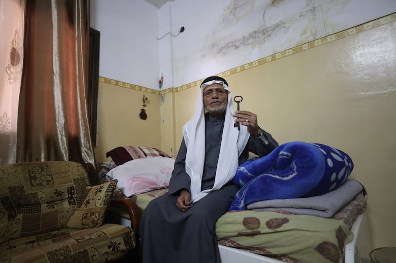 Palestinian Mustafa Abu Awad, 86, holds the key to the house he owned in 1948. All photos: EPA