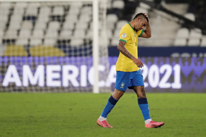 Brazil's Gabriel Jesus exits the pitch after being sent off,.
