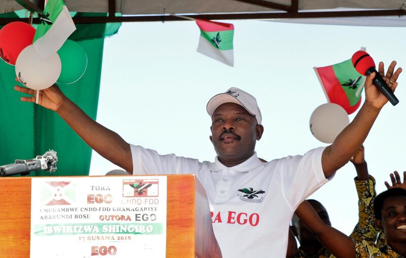 In this photo taken Wednesday, May 2, 2018, President Pierre Nkurunziza gestures as he launches the ruling party's campaign calling for a "Yes" vote in the upcoming constitutional referendum, in Bugendana, Gitega province, Burundi. One ruling party official urged people "to castrate the enemy." Another called for drowning the regime's opponents in a lake. The hate speech spells trouble in Burundi, where a May 17 referendum could further extend President Pierre Nkurunziza's rule and usher in a new wave of bloodshed. (AP Photo)