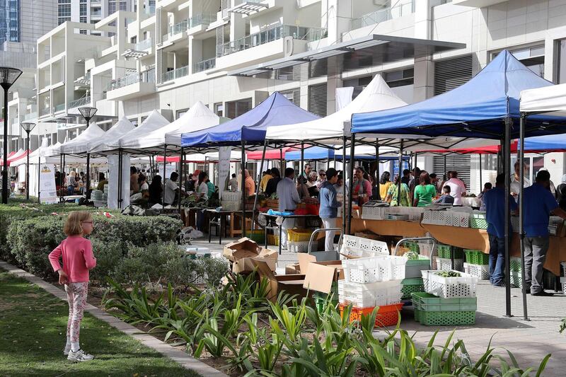 DUBAI , UNITED ARAB EMIRATES , January 18 ��� 2019 :- People buying vegetable , fruits and other organic items at the Farmers Market held at the Bay Avenue in Business Bay in Dubai. (Pawan Singh / The National ) For News/Online/Instagram. Story by Patrick