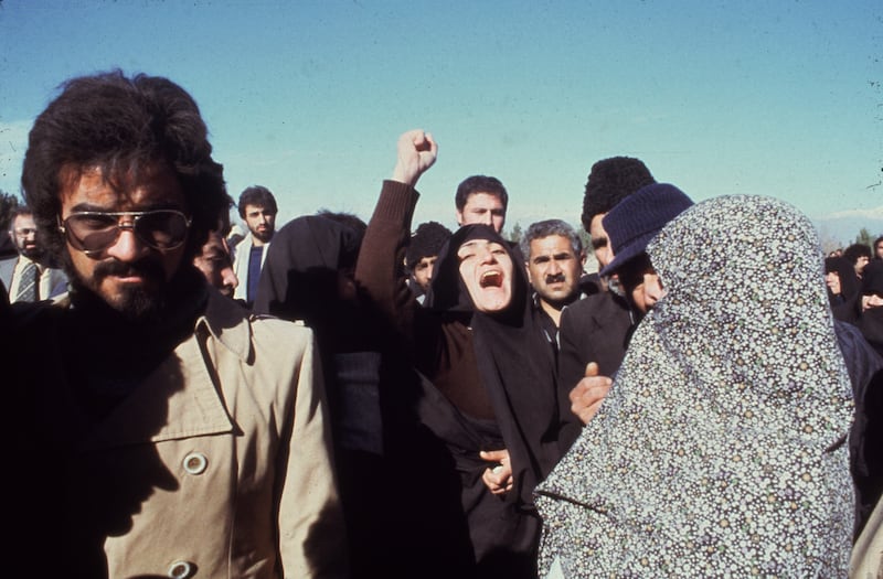 A protester shakes her fist during demonstrations calling for the Shah of Iran to be unseated, on January 1, 1979. Getty Images