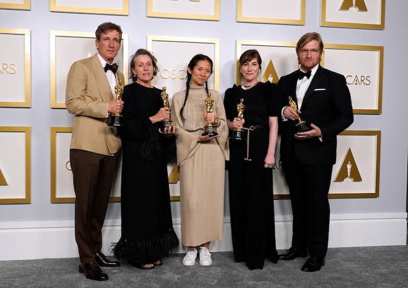 Best Picture: 'Nomadland' cast and producers, from left: Peter Spears, Frances McDormand, Chloe Zhao, Mollye Asher and Dan Janvey, pose in the press room at the Oscars on Sunday, April 25, 2021, at Union Station in Los Angeles. AP Photo