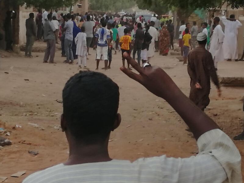 A Sudanese protester raises the victory sign during an anti-government demonstration in Khartoum on February 15, 2019. Sudan on February 14 accused campaigners spearheading protests against President Omar al-Bashir's rule of threatening national security and advocating violence, as hundreds of demonstrators staged more rallies. / AFP / -
