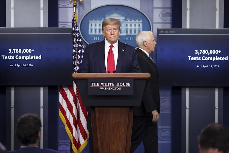 U.S. President Donald Trump, center, and Vice President Mike Pence, arrive to a news conference at the White House in Washington D.C., U.S. on Friday, April 17, 2020. Trump said there’s enough coronavirus testing capacity to put in place his plan to allow a phased reopening of the economy, even though some state officials and business leaders have raised alarms about shortages. Photographer: Oliver Contreras/Sipa/Bloomberg