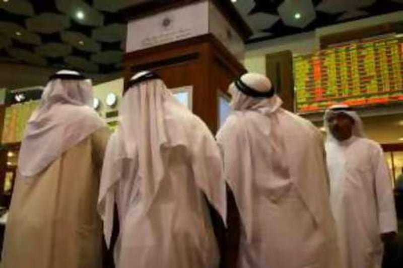 DUBAI, UNITED ARAB EMIRATES – Sep 16: Some of the traders at Dubai Financial Market in Dubai.  (Pawan Singh / The National)
 *** Local Caption ***  PS004- DFM.jpg