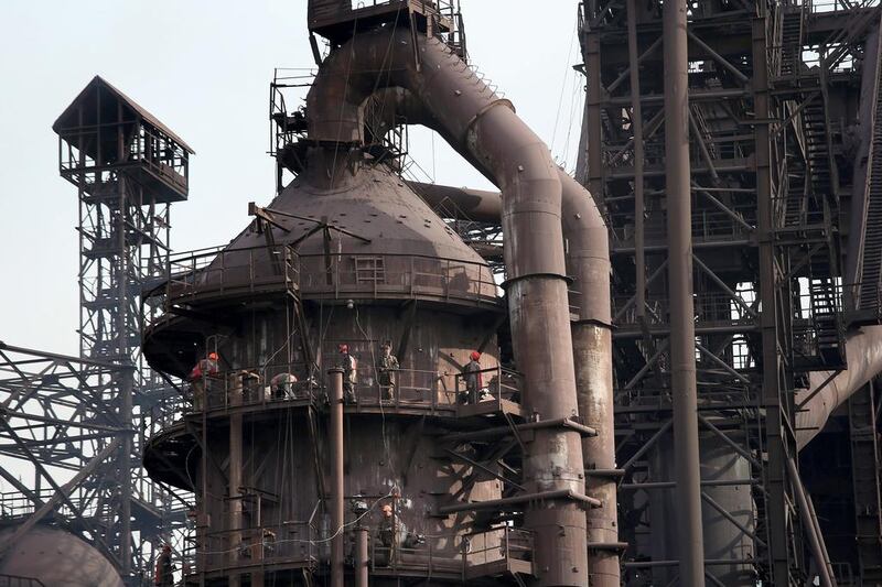 Above, the Ilyich Iron and Steel Works. Rinat Akhmetov, the owner of the factory and richest man in Ukraine, has enlisted his 300,000 employees to end the turmoil unleashed by the armed takeover of pro-Russian separatists in Mairupol. John Moore / Getty Images