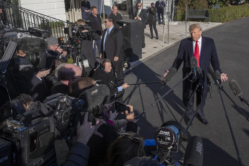 U.S. President Donald Trump speaks to members of the media on the South Lawn of the White House after arriving on Marine One in Washington, D.C., U.S., on Sunday, Jan. 6, 2019. Trump edged closer toward a radical move to fund his border wall after the prospect of a deal with the Democrats to re-open government dimmed and the president's political leverage appeared to dissipate. Photographer: Tasos Katopodis/Bloomberg