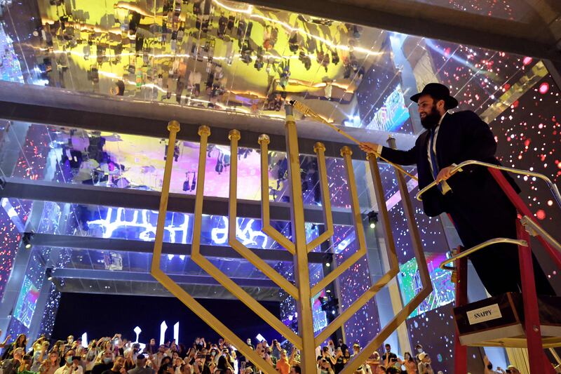 Rabbi Levi Duchman lights a large menorah. AFP