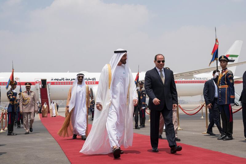 CAIRO, EGYPT - August 07, 2018: HH Sheikh Mohamed bin Zayed Al Nahyan Crown Prince of Abu Dhabi and Deputy Supreme Commander of the UAE Armed Forces (centre L), is received by HE Abdel Fattah El Sisi, President of Egypt (centre R), upon arrival at Cairo international Airport, commencing an official visit. Seen with HH Sheikh Nahyan Bin Zayed Al Nahyan, Chairman of the Board of Trustees of Zayed bin Sultan Al Nahyan Charitable and Humanitarian Foundation (back C).

( Mohamed Al Hammadi / Crown Prince Court - Abu Dhabi )
---