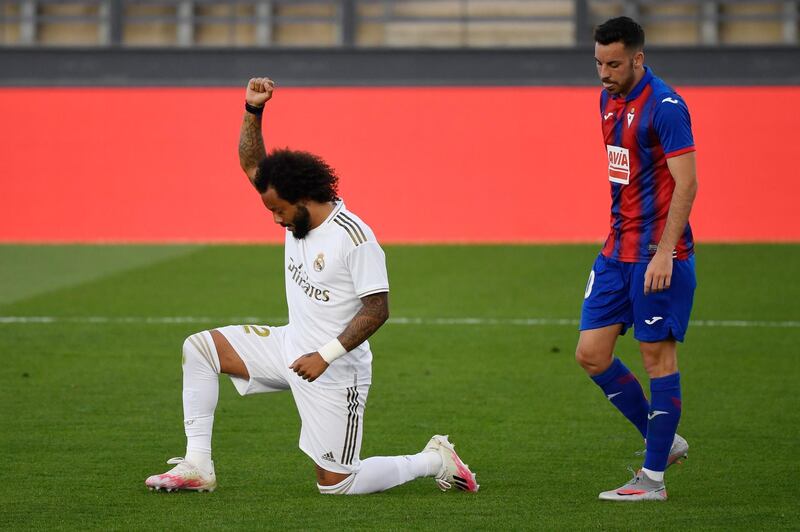 Real Madrid's Brazilian defender Marcelo kneels  to celebrate his goal during the Spanish League match between Real Madrid and Eibar at the Alfredo di Stefano stadium in Valdebebas, on the outskirts of Madrid. AFP