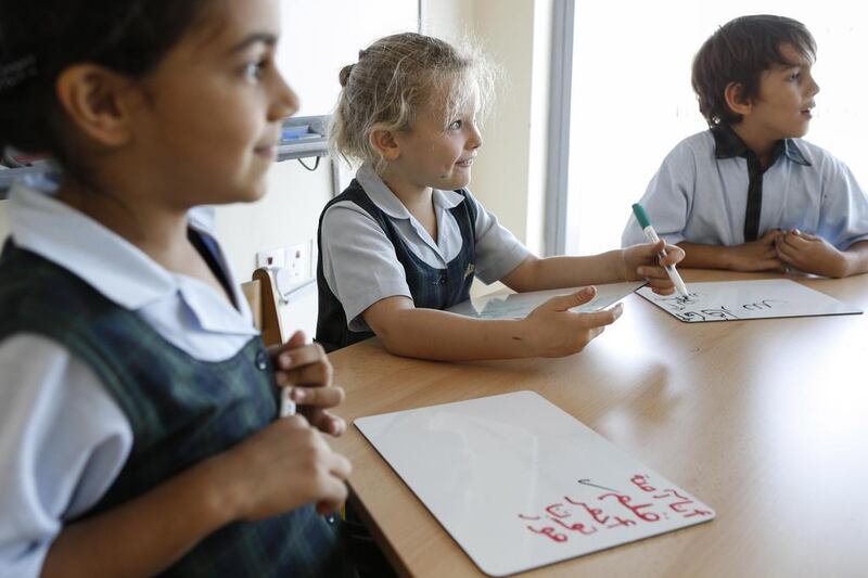 British pupil Matilda Dando, 5, practises her written Arabic skills in a Year 1 class at Kings’ School Dubai in Umm Suqeim, which was again classified as 'outstanding' by the KHDA. Antonie Robertson / The National 