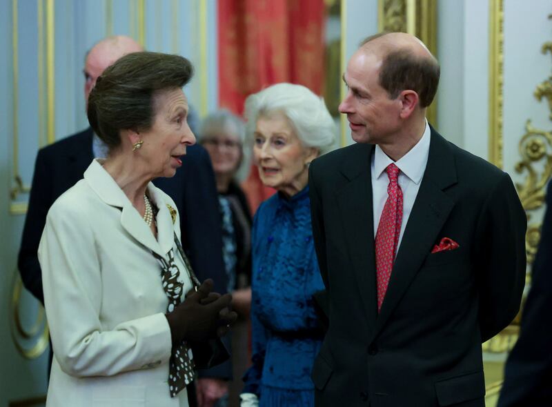 Princess Royal Anne and Prince Edward chat at the reception. AP