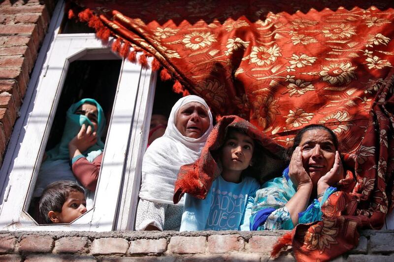 People react as they see the body of Nasir Shafi, who according to local residents was shot by Indian security forces during a protest on Friday evening in Theed on the outskirts of Srinagar. Danish Ismail / Reuters