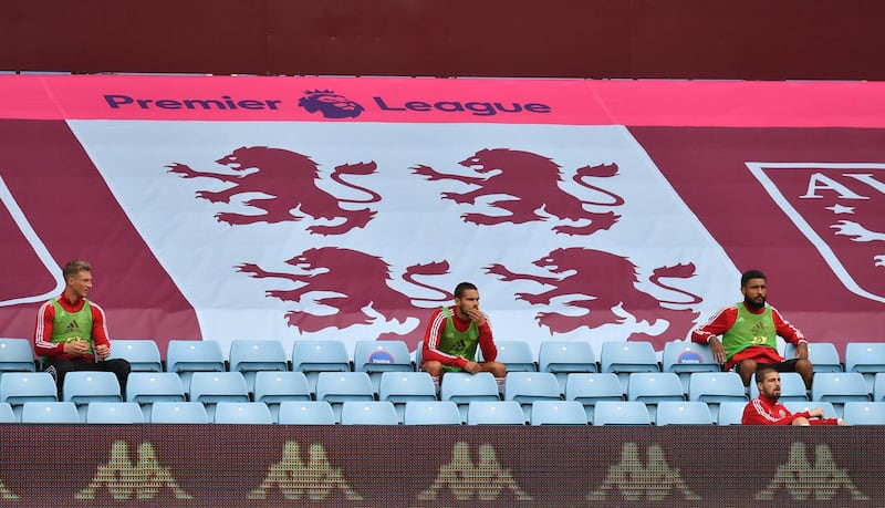 Sheffield United players look on from the stands at Villa Park. AFP