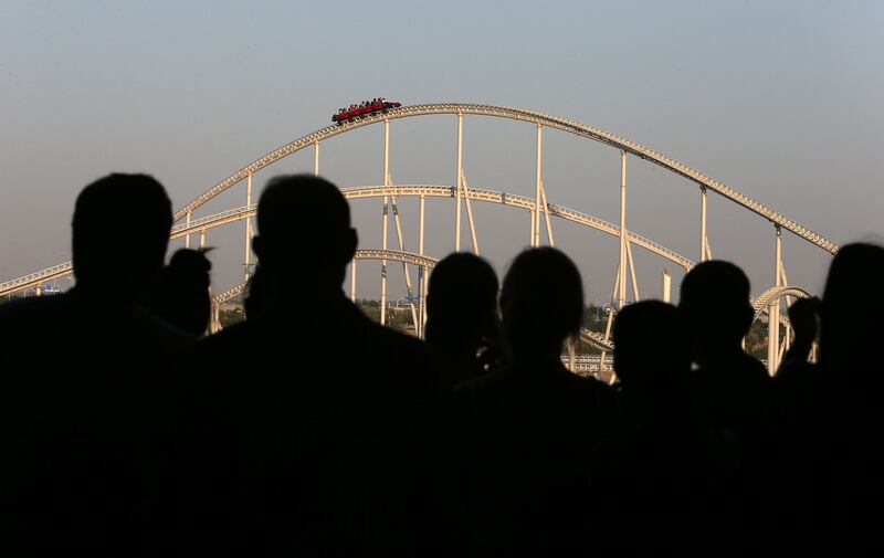 
ABU DHABI , UNITED ARAB EMIRATES : Oct 30 , 2013 :- People enjoying the fastest roller coaster at the Ferrari World in Abu Dhabi. ( Pawan Singh / The National ) . For News. Story by Emily Cleland
 *** Local Caption ***  PS3010- FERRARI WORLD01.jpg