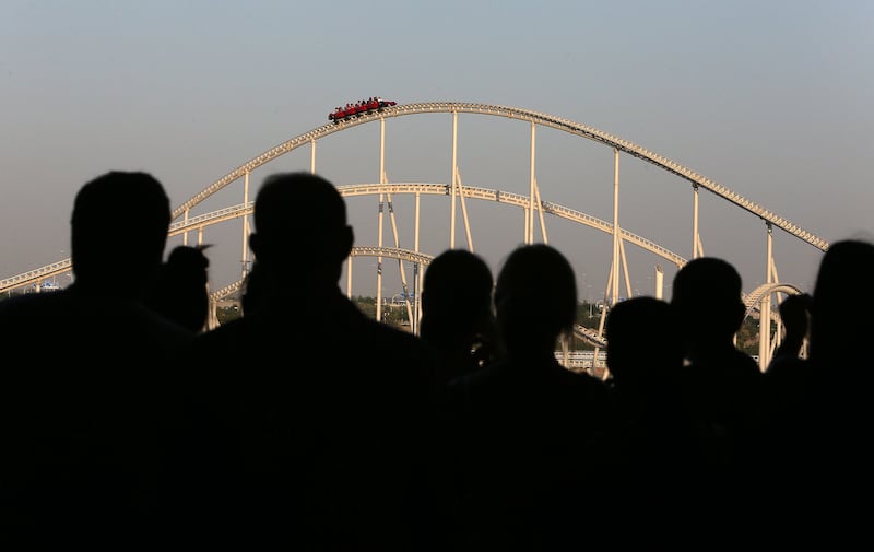 ABU DHABI , UNITED ARAB EMIRATES : Oct 30 , 2013 :- People enjoying the fastest roller coaster at the Ferrari World in Abu Dhabi. ( Pawan Singh / The National ) . For News. Story by Emily Cleland *** Local Caption ***  PS3010- FERRARI WORLD01.jpg