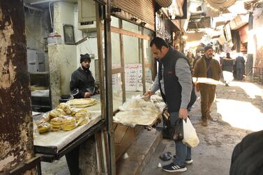 Syrians shopping for their basic daily needs at one on the traditional markets in Damascus. EPA