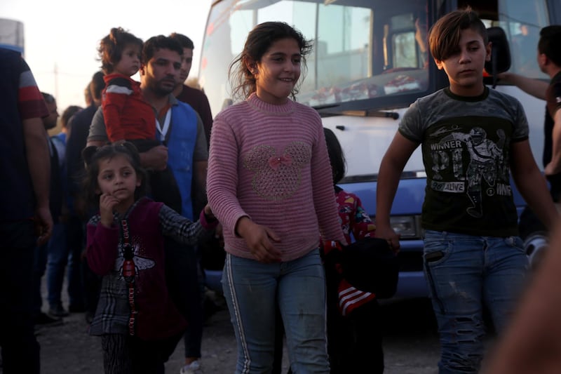 epa07925962 Kurdish Syrian refugees fleeing the Turkish military operation in Syria arrive to Bradasrsh Refugee camp, in Duhok, Kurdistan Region of Iraq, 16 October 2019. Some 280 refugee arrived to Duhok.  EPA/GAILAN HAJI