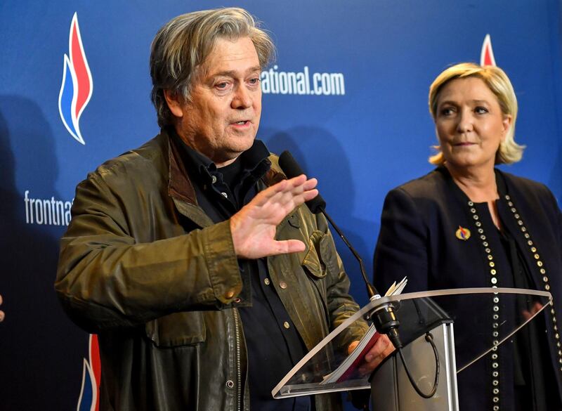 Former White House strategist Steve Bannon holds a press conference with National Front party leader Marine Le Pen, right, at the party congress in the northern French city of Lille, Saturday, March 10, 2018. Steve Bannon has given a big boost to French far right leader Marine Le Pen, telling a cheering crowd at a congress of her National Front party that "history is on our side." (AP Photo)