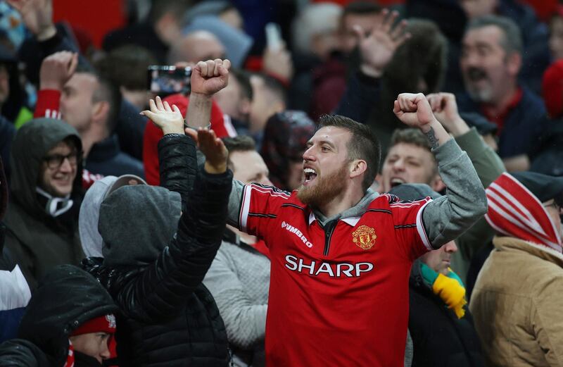 Soccer Football - Premier League - Manchester United v Manchester City - Old Trafford, Manchester, Britain - March 8, 2020  Manchester United fans celebrates their second goal   Action Images via Reuters/Carl Recine  EDITORIAL USE ONLY. No use with unauthorized audio, video, data, fixture lists, club/league logos or "live" services. Online in-match use limited to 75 images, no video emulation. No use in betting, games or single club/league/player publications.  Please contact your account representative for further details.