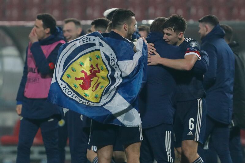 Scotland players celebrate after winning on penalties against Serbia. AP