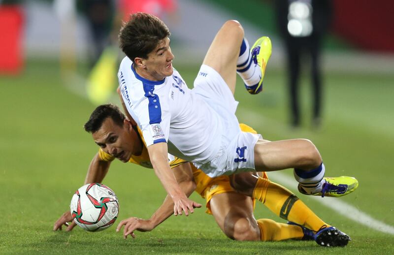 Trent Sainsbury of Australia, left, in action against Eldor Shomurodov of Uzbekistan during the 2019 Asian Cup last-16 match in Al Ain. EPA