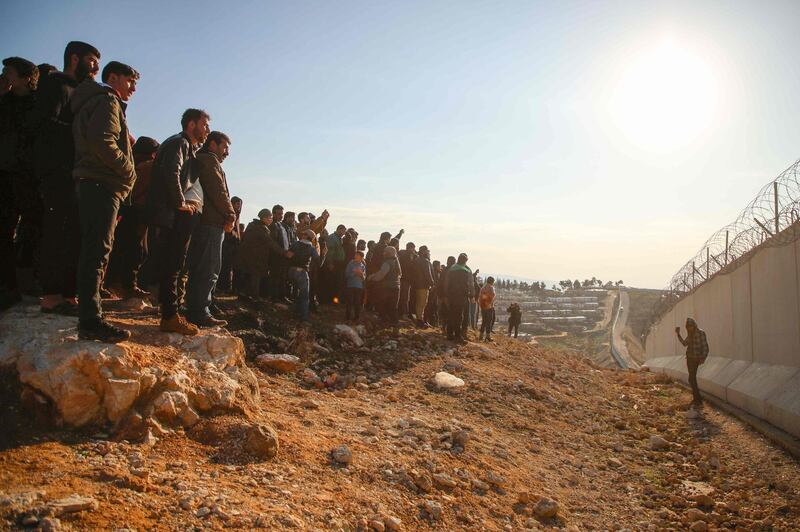 Syrians gather during a symbolic protest in the city of Harem in the rebel-held northern countryside of Syria's Idlib on the border with Turkey.  AFP