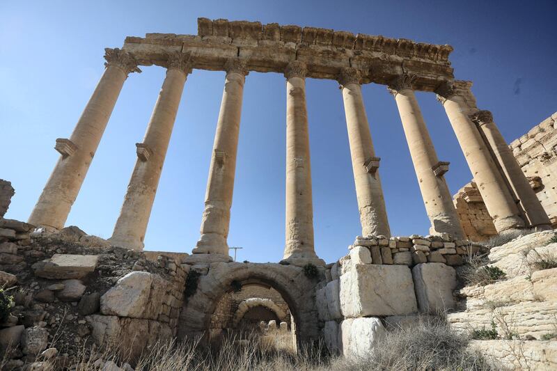 A picture shows the ruins of Syria's Roman-era ancient city of Palmyra on February 7, 2021, in the country's central province of Homs. - Syria has six sites listed on the UNESCO elite list of world heritage and all of them sustained some level of damage in the 10-year war. Besides Palmyra and Aleppo, the ancient cities of Damascus and Bosra also sustained some damage. (Photo by LOUAI BESHARA / AFP)