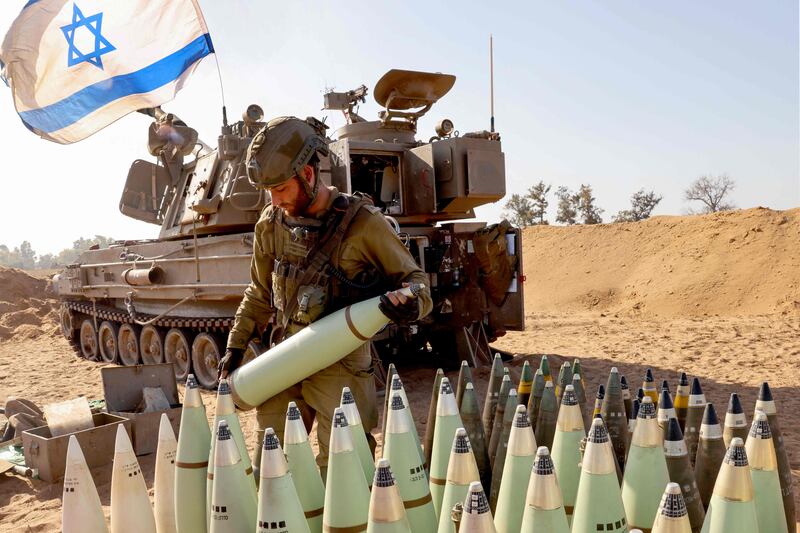 An Israeli soldier arranges artillery shells near the border with the Gaza Strip. AFP