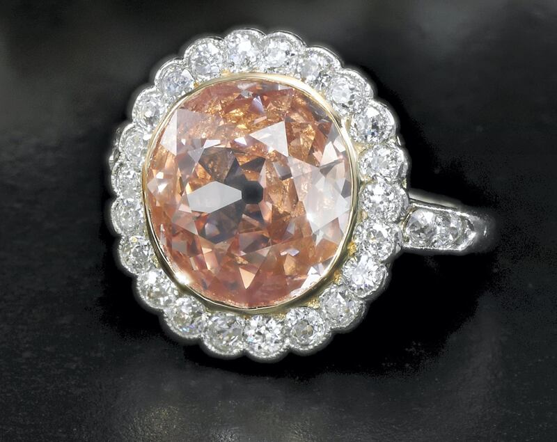 A diamond ring set with a 2.44-carat fancy orangy pink diamond, which sold for Dh2.1 million.
