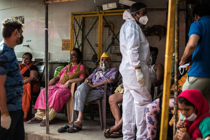 Patients suffering from Covid-19 are treated with free oxygen at a makeshift clinic outside the Shri Guru Singh Sabha Gurdwara in Indirapuram, Uttar Pradesh, India. Getty Images