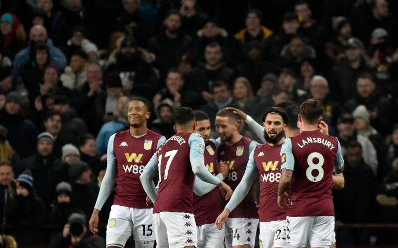 Aston Villa's Conor Hourihane, centrr, celebrates with teammates after scoring his side's opening goal. AP
