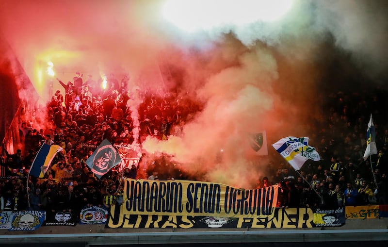epa07119509 Supporters of Fenerbahce SK light flares during the UEFA Europa League soccer match between RSC Anderlecht and Fenerbahce SK at the Constant Vanden Stock stadium in Anderlecht, Belgium, 25 October 2018.  EPA/STEPHANIE LECOCQ