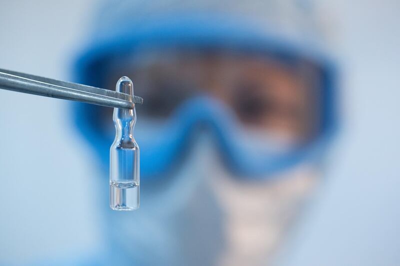 A handout photo shows an employee demonstrating a vial with "Gam-COVID-Vac" vaccine against the coronavirus disease (COVID-19), developed by the Gamaleya National Research Institute of Epidemiology and Microbiology and the Russian Direct Investment Fund (RDIF), during its production at Binnopharm pharmaceutical company in Zelenograd near Moscow, Russia August 7, 2020. Picture taken August 7, 2020. The Russian Direct Investment Fund (RDIF)/Andrey Rudakov/Handout via REUTERS  ATTENTION EDITORS - THIS IMAGE WAS PROVIDED BY A THIRD PARTY. NO RESALES. NO ARCHIVES. MANDATORY CREDIT.