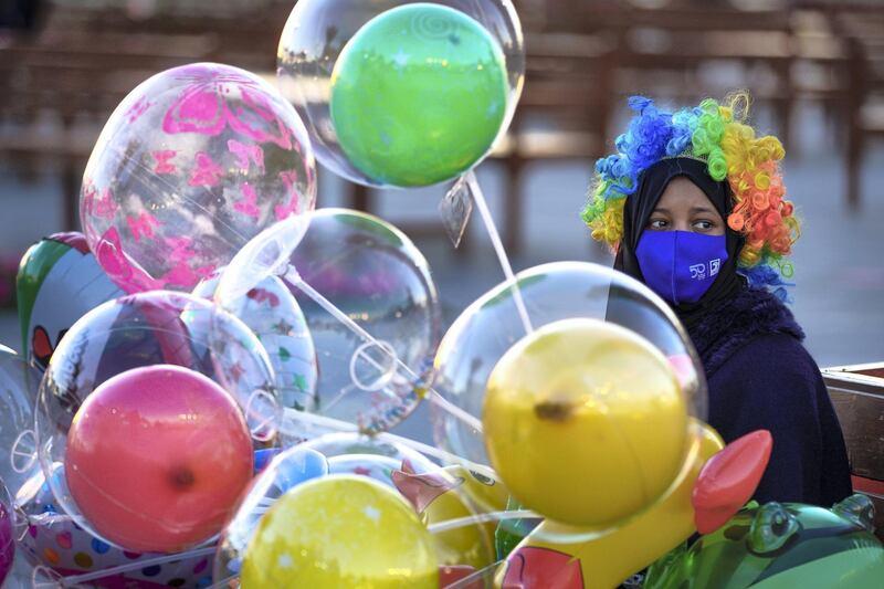 Abu Dhabi, United Arab Emirates, January 10, 2021. A baloon vendor at the Sheikh Zayed Festival.
Victor Besa/The National
Section:  NA
Reporter:  Saeed Saeed