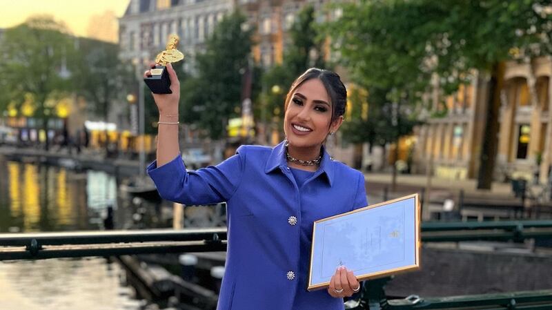 Emirati actress Amal Mohamed shows off her Septimius Award for Best Asian Actress, in Amsterdam. Photo: Shams