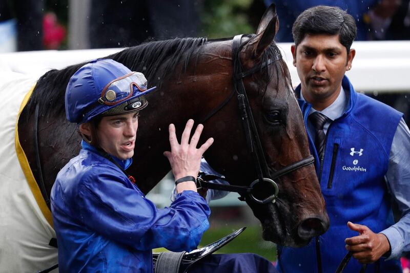 Jockey James Doyle leads horse Blue Point after winning the King's Stand Stakes on Day 1 of Royal Ascot. AFP