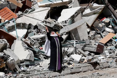 A woman wails near the rubble of Al Jaala building in the heart of Gaza City after it was destroyed by an Israeli air strike on May 15, 2021. AP Photo