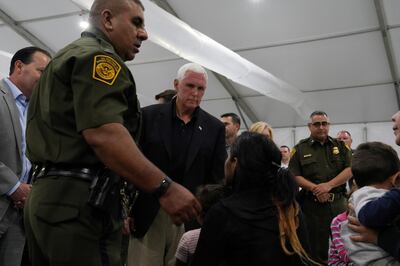 U.S. Vice President Mike Pence talks to asylum-seekers at the Donna Soft-Sided Processing Facility in Donna, Texas, U.S. July 12, 2019.  REUTERS/Veronica G. Cardenas