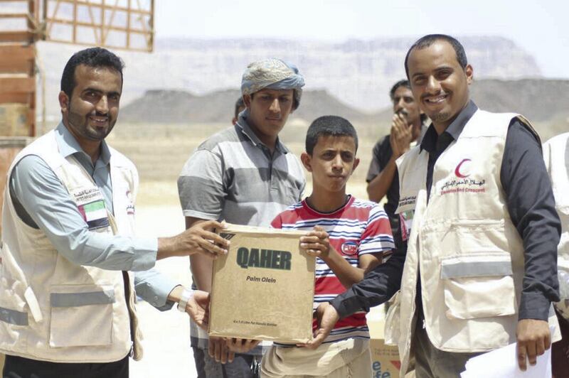 Emirates Red Crescent distributes emergency food aid in the Shabwa Governorate of Yemen on Monday. Wam