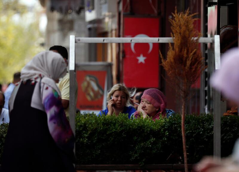 People gather near Fatih mosque in Istanbul. Syrians say Turkey has been detaining and forcing some Syrian refugees to return back to their country the past month. The expulsions reflect increasing anti-refugee sentiment in Turkey, which opened its doors to millions of Syrians fleeing their country's civil war. AP Photo