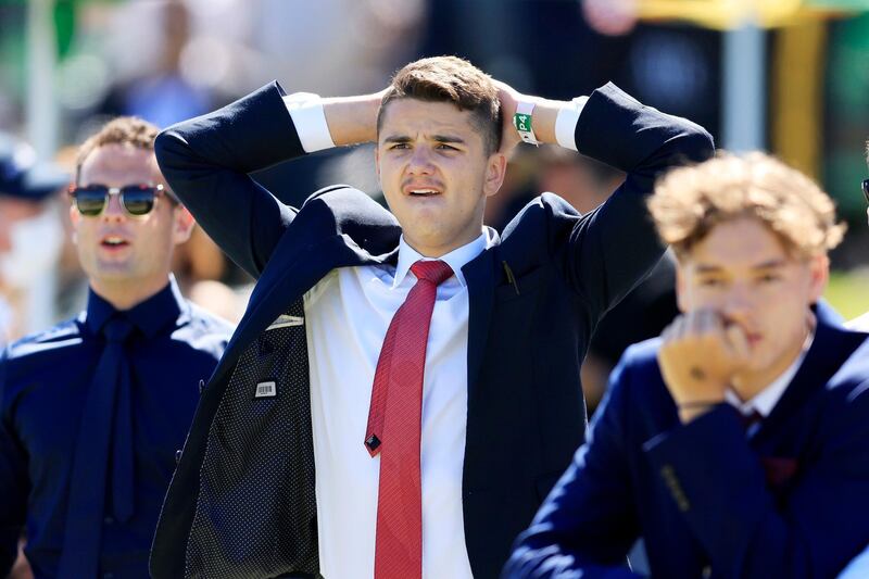 Punters react as they watch the Melbourne Cup on the big screen at Royal Randwick Racecourse in Sydney. Getty Images