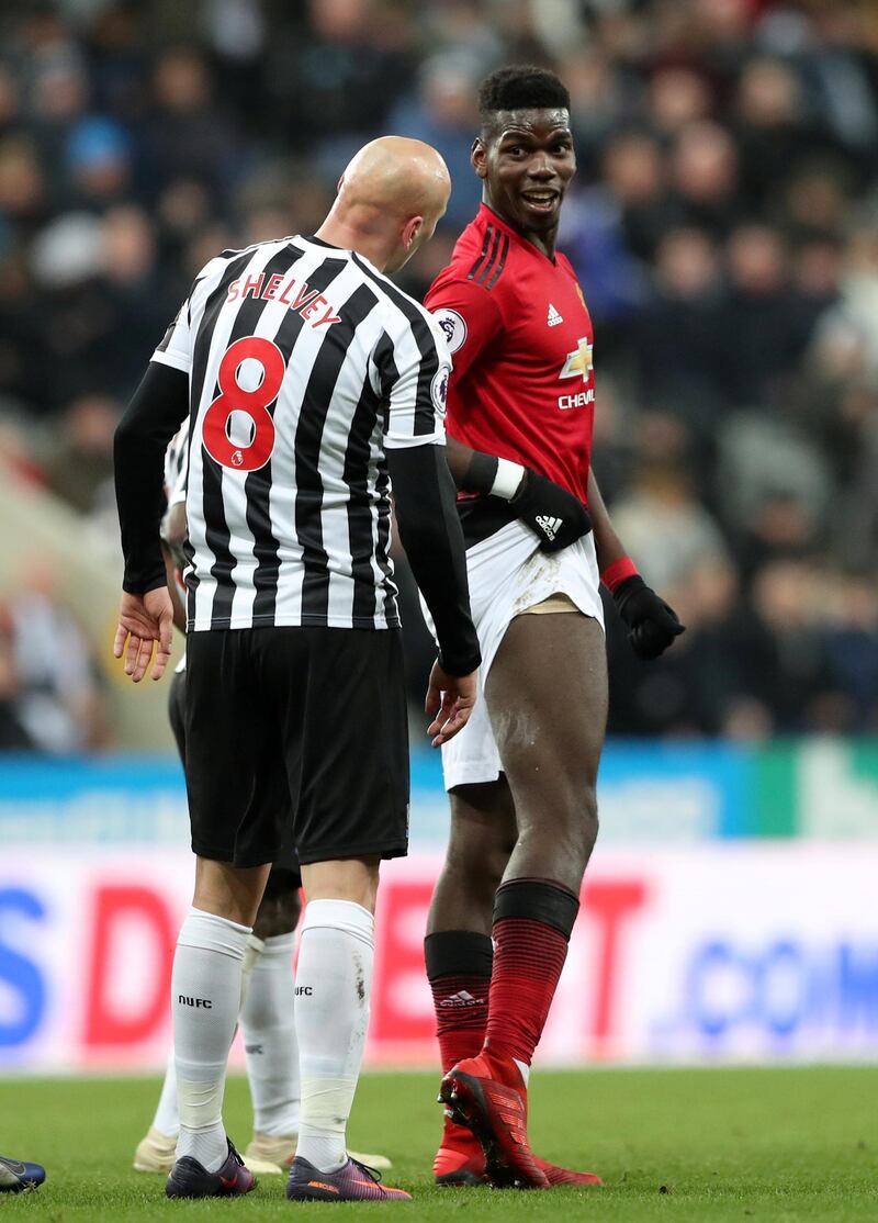 Manchester United's Paul Pogba shows his leg to Newcastle United's Jonjo Shelvey after a bad challenge. Reuters